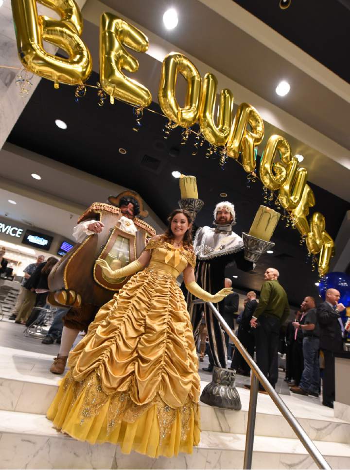 Francisco Kjolseth | The Salt Lake Tribune
Dan Call, Amber Jones and Ricky Parkinson, from left, bring the characters of "Beauty and the Beast" to life for the grand opening of the new Megaplex Luxury Theatres at Cottonwood, 1945 E. Murray Holladay Road.