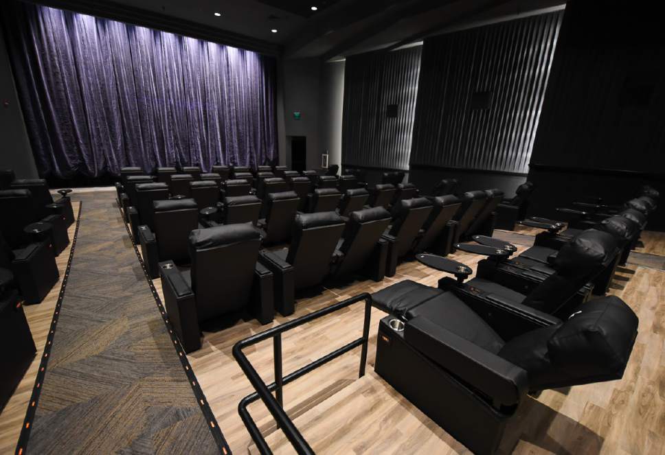 Francisco Kjolseth | The Salt Lake Tribune
Megaplex Luxury Theatres at Cottonwood, 1945 E. Murray Holladay Road, opens  with a fresh remodel that includes reclining heated seats and a swiveling table on each chair.