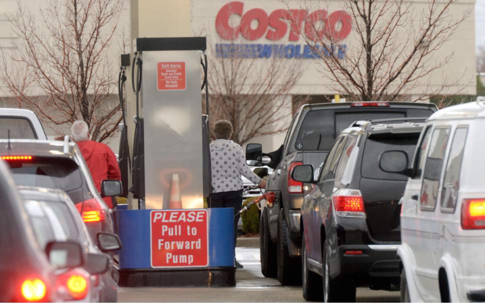 Al Hartmann  |  Tribune file photo
Drivers line up for gas at Costco at 1800 S. 300 West in Salt Lake City. Cities complain they are not getting their fair share of the last gas-tax increase, prompting some to raise property taxes.