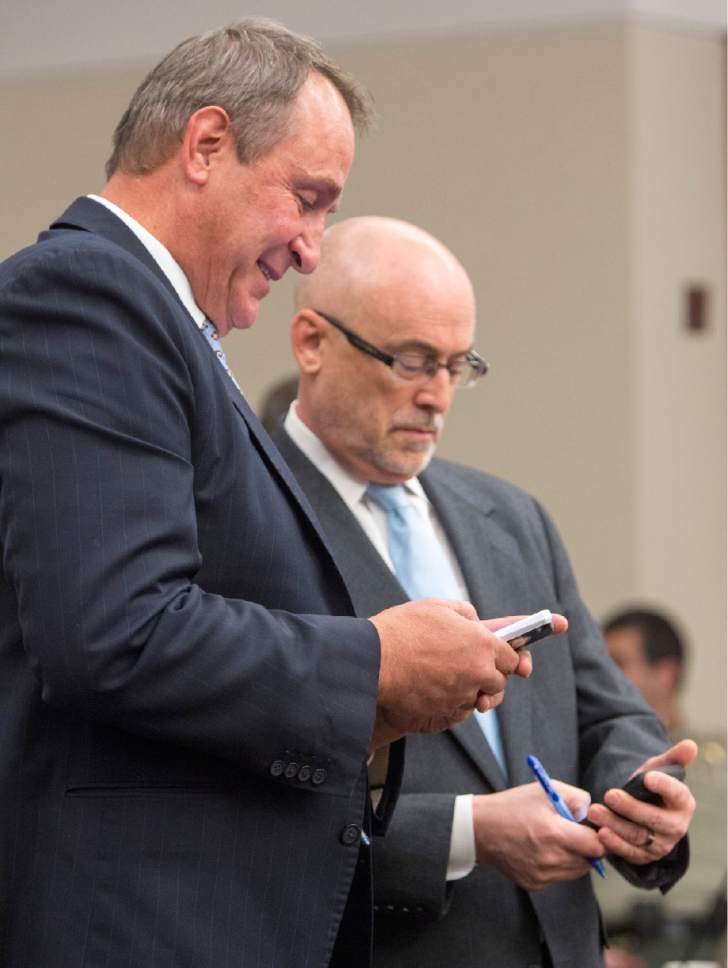 Rick Egan  |  The Salt Lake Tribune

Former Attorney General Mark Shurtleff and his attorney Richard Van Wagoner check their schedules during a scheduling hearing at the Matheson Courthouse, Monday, March 23, 2015. Third District Court Judge Randall Skanchy set a June 15 date for a hearing to determine whether Shurtleff will stand trial on bribery and corruption charges.
