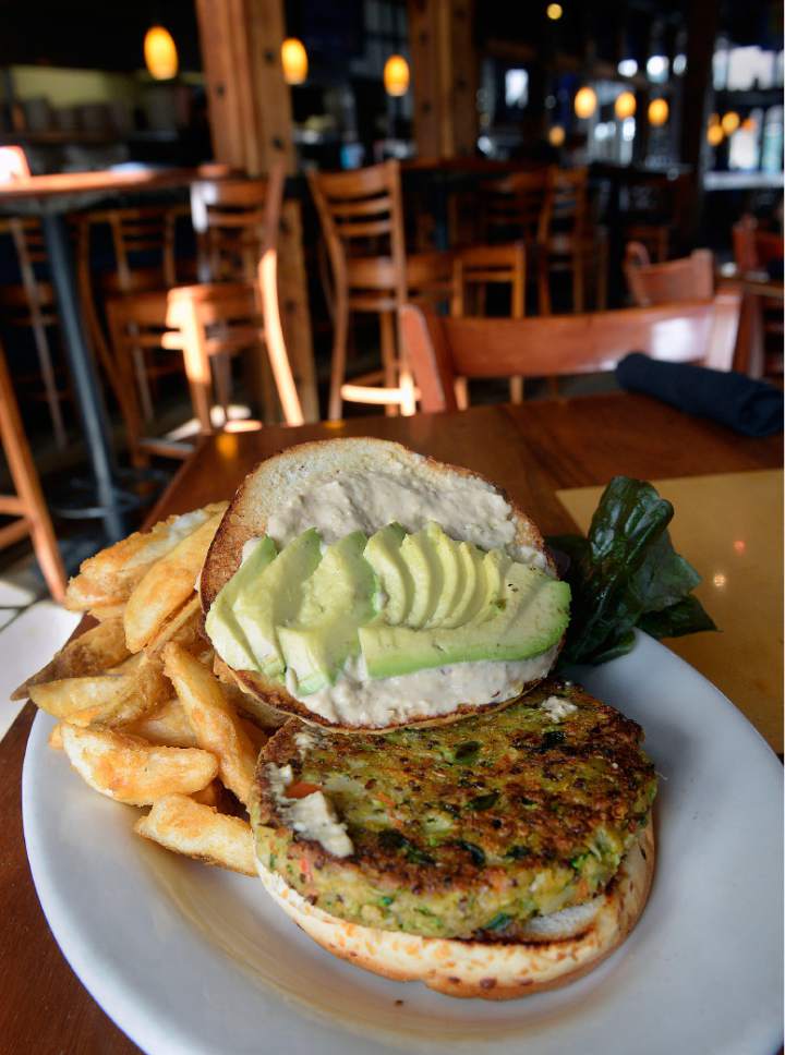Al Hartmann  |  The Salt Lake Tribune
Squatters'  Chef's Veggie Burger, made with quinoa, garbanzo beans, roasted vegetables and topped with avocado and hummus.