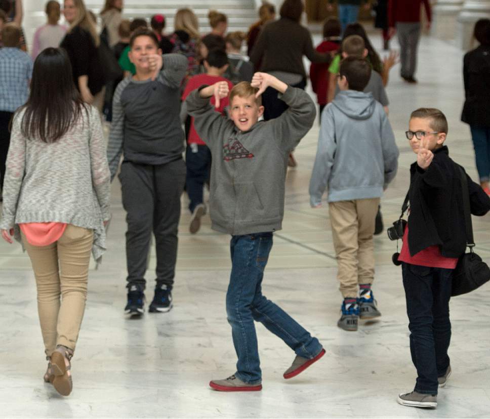 Rick Egan  |  The Salt Lake Tribune

A group of school students react to a supporter with a Trump 2020 sign, as they tour the Capitol Rotunda, Tuesday, March 7, 2017.