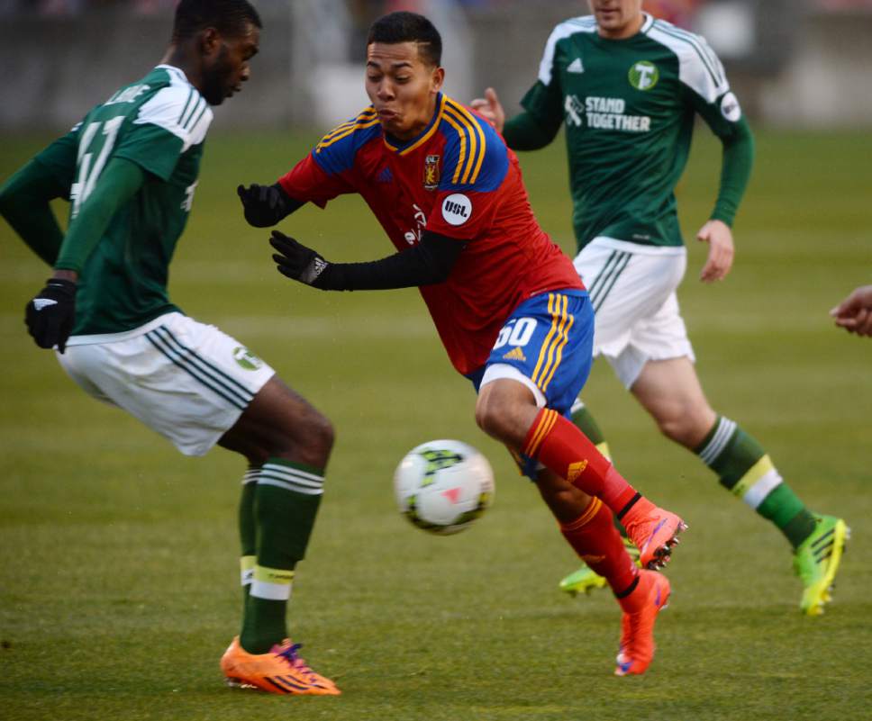 Steve Griffin  |  The Salt Lake Tribune

Sebastian Saucedo of the Real Monarchs braces himself as he crashes into Portland Timbers 2 defender Rennico Clarke at Rio Tinto Stadium in Sandy, Wednesday, April 8, 2015.