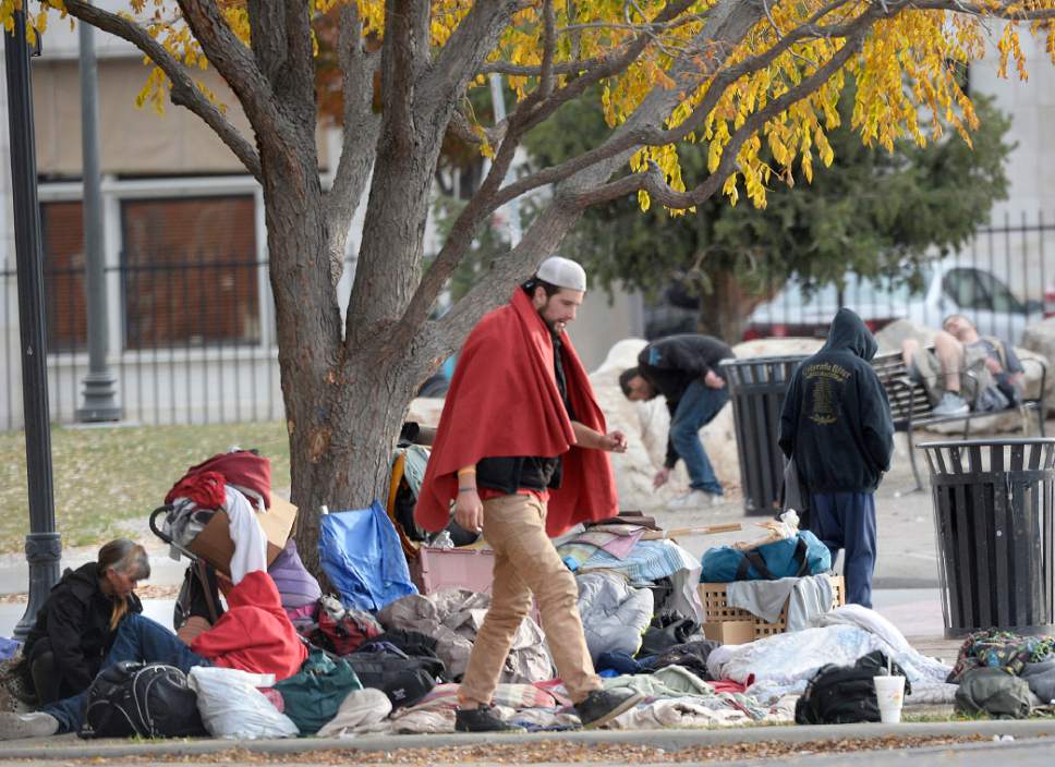 Al Hartmann  |  The Salt Lake Tribune
Homeless gather for the day with their belongings in one of many small camps in the Rio Grande neighborhood Friday morning October 28.  There are a number of camps along 500 West betwen 200 South and 400 South. Salt Lake City officials are planning for additional emergency shelter space for homeless people when temperatures begin to drop for the winter.