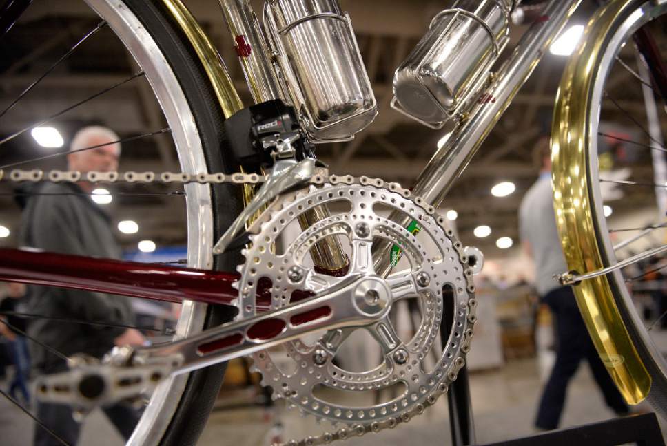 Al Hartmann  |  The Salt Lake Tribune
Detail work on a handmade Shamrock bicycle at the 2017 North American Handmade Bicycle Show at the Salt Palace Convention Center Friday March 10.  Shamrock Cycles are made in Indiana.   They have an old world feel using polished lugs and tubes, single color paint and leather parts. 
It's the largest and oldest handbuilt bicycle show in the world where ideas and innovation come together to promote custom bicycles and the companies that support the market.  It's the show's first time in Utah. The event runs Friday, March 10, to Sunday, March 12.