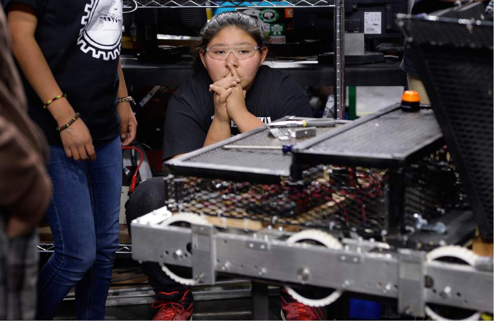Scott Sommerdorf | The Salt Lake Tribune
Breanna Bitsinnie waits as others try to overcome an issue with fitting new bumpers on the robot. Navajo Mountain High School robotics team competes at the "Utah FIRST Robotics Competition," Thursday, March 9, 2017.