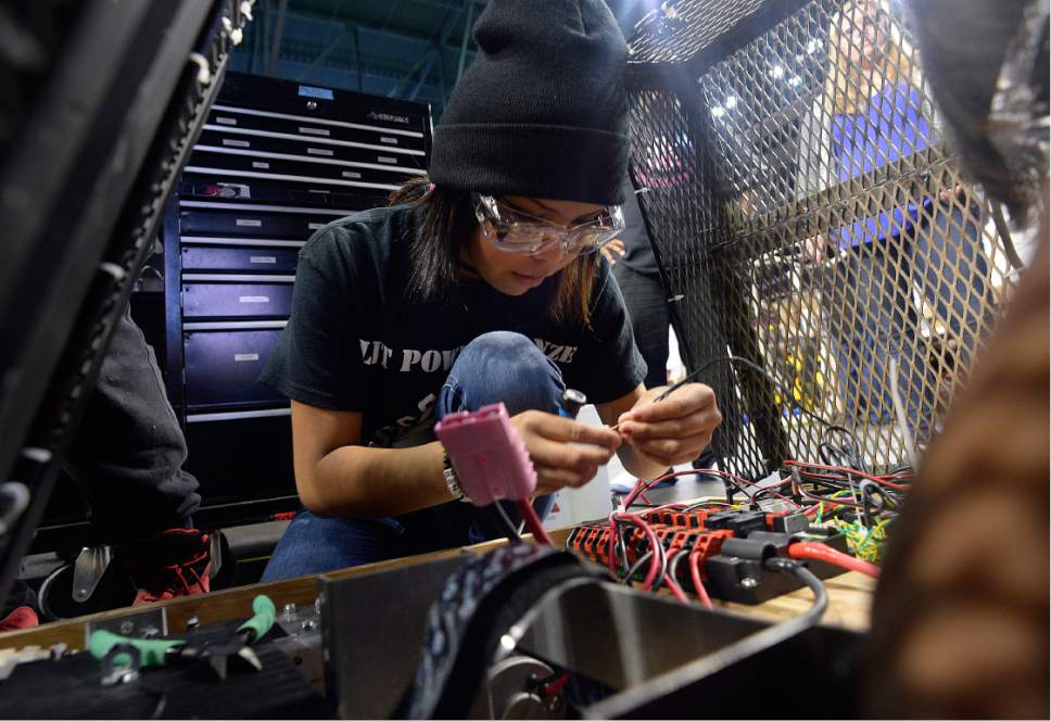 Scott Sommerdorf | The Salt Lake Tribune
Myra King works on re-wiring the robot after a new power source was installed as the Navajo Mountain High School robotics team competes at the "Utah FIRST Robotics Competition," Thursday, March 9, 2017.