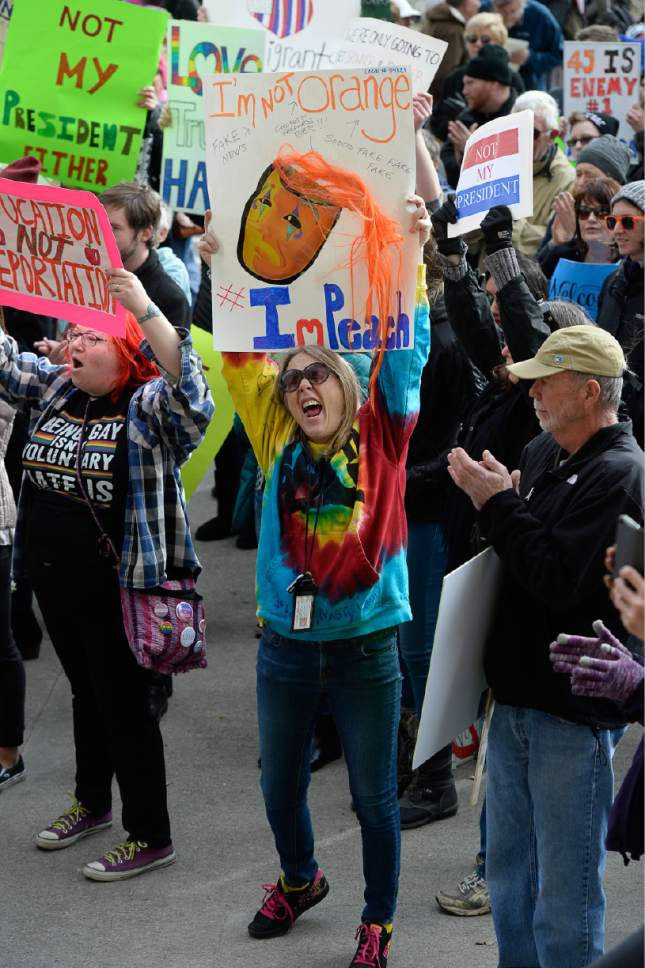 Francisco Kjolseth | The Salt Lake Tribune
Jane Otis joins protesters as they gather at Washington Square on President's Day in Salt Lake City, Monday, Feb. 20, 2017, to protest President Donald Trump.