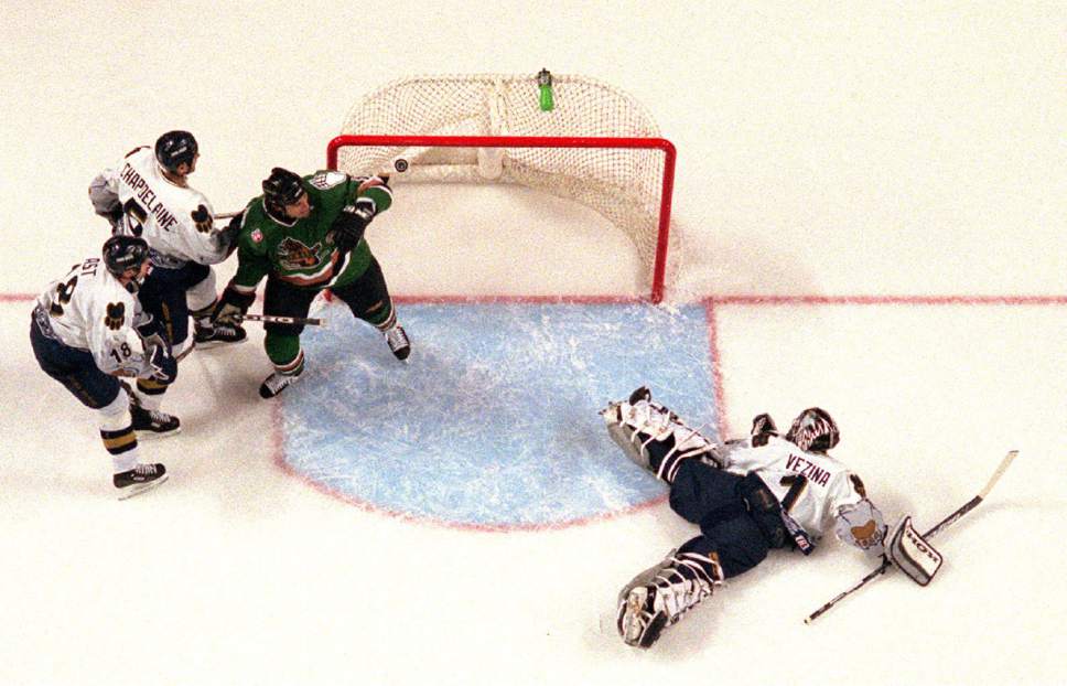 Rick Egan  |  The Salt Lake Tribune

Ice Dogs goalie Steve Vezina lies on his stomach as he watches the puck go past him into the goal on November 24, 1999. To the left of the net Ice Dog's Rene Chapdelaine and Doug Ast battle with Mick Vukota of the Grrizziles.