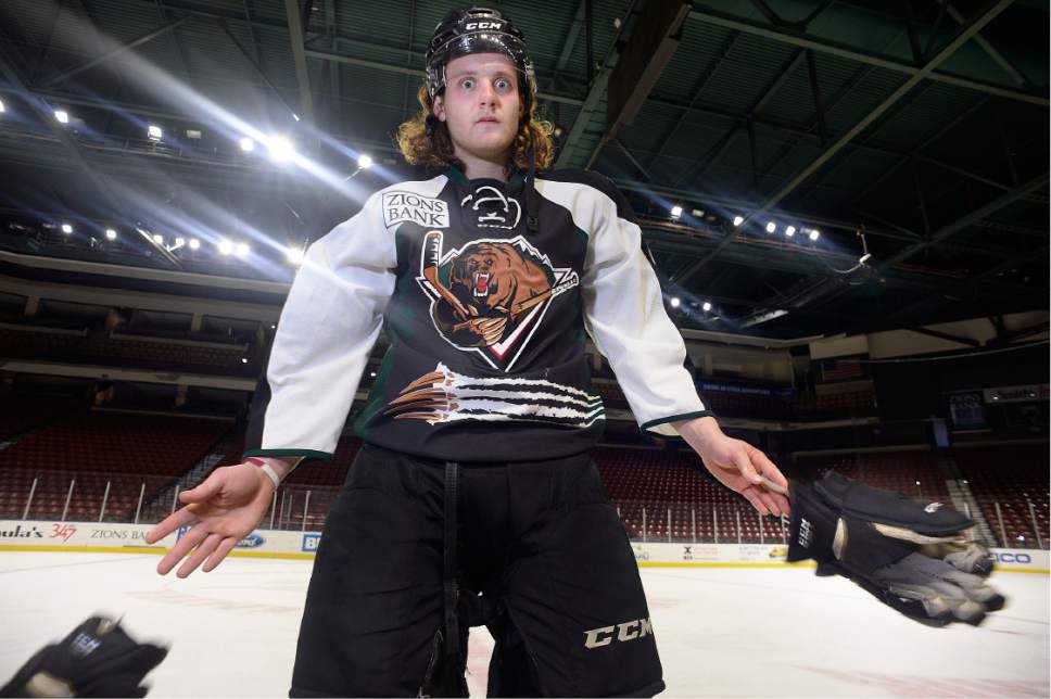 Scott Sommerdorf | The Salt Lake Tribune
Utah Grizzlies hockey player Travis Howe drops his gloves with his "crazy fight eyes" for a portrait after practice, Thursday, March 2, 2017.