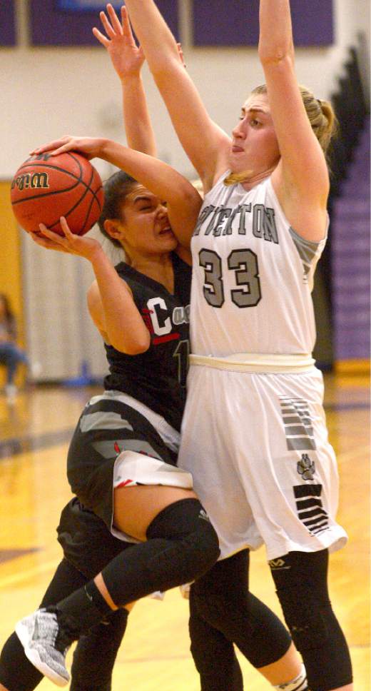 Leah Hogsten  |  The Salt Lake Tribune
American Fork's Taylor Moeaki runs into Riverton's Morgan Kane trying to make it to the net. American Fork High School leads Riverton High School girls basketball team 25-24 during their game Tuesday, January 24, 2017 at Riverton.