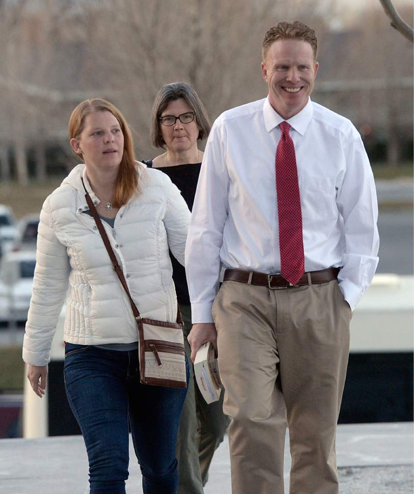 Al Hartmann  |  The Salt Lake Tribune
Jeremy Johnson walks to federal court in  Salt Lake City on Tuesday, March 14, accompanied by his wife, Sharla, and lawyer Karra Porter.  He was released from the Salt Lake County Jail on Monday and no federal authorities were on hand to take him back into custody. So he spent the night in a hotel and then turned himself back in Tuesday morning.