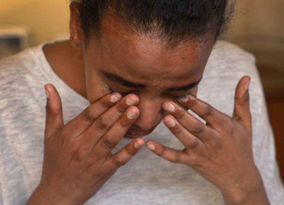 Leah Hogsten  |  The Salt Lake Tribune
Tears fall from Rita Okbalidet as she talks about the plight of her mother and three younger siblings. Okbalidet, 20, is a refugee from Eritrea, Africa who came to Utah in 2014 with the help of Utah's Catholic Community Services' Refugee Resettlement Program. Okbalidet was sold by her guardian in Sudan, held for ransom in Sinai and dropped off blindfolded and alone in Cairo before receiving assistance from the United Nations High Commissioner for Refugees. Now she says she has many goals to accomplish. In a few months, Okbalidet will begin a nursing program at SLCC and hopes to bring her sister Miriam, 15, who is a refugee to Utah from Sudan.