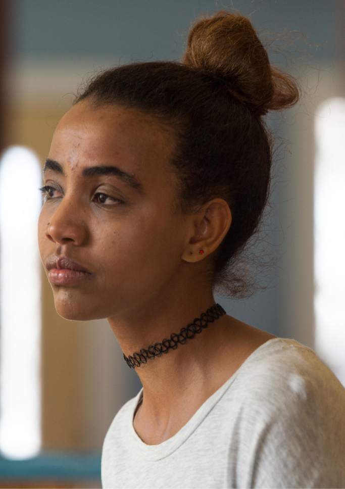 Leah Hogsten  |  The Salt Lake Tribune
"Half of me is with my family," said Rita Okbalidet, 20, a refugee from Eritrea, Africa who came to Utah in 2014 with the help of Utah's Catholic Community Services' Refugee Resettlement Program. Okbalidet was sold by her guardian in Sudan, held for ransom in Sinai and dropped off blindfolded and alone in Cairo before receiving assistance from the United Nations High Commissioner for Refugees. Now she says she has many goals to accomplish. In a few months, Okbalidet will begin a nursing program at SLCC and hopes to bring her sister Miriam, 15, who is a refugee to Utah from Sudan.