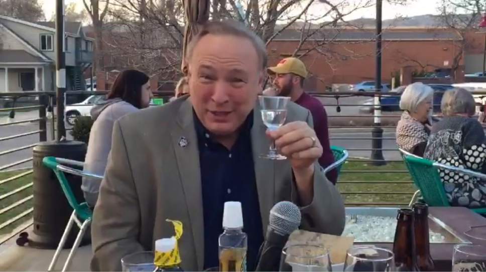 In this image taken from a Facebook Live video, Sen. Jim Dabakis, D-Salt Lake City, is shown drinking liquor and swishing mouthwash before taking a test to monitor his blood-alcohol content. Dabakis and friends shared the video, filmed at a Salt Lake City bar, to urge Gov. Gary Herbert to veto a bill that would lower Utah's DUI blood-alcohol limit.