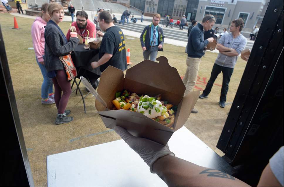 Scott Sommerdorf | The Salt Lake Tribune
An order of poutinewaits to be claimed from the Poutine Your Mouth food truck at  The Gateway on  Wednesday, March 8, 2017, during "Food Trucks at the Fountain." The Gateway  is expanding the program to five days a week beginning Monday, March 20.