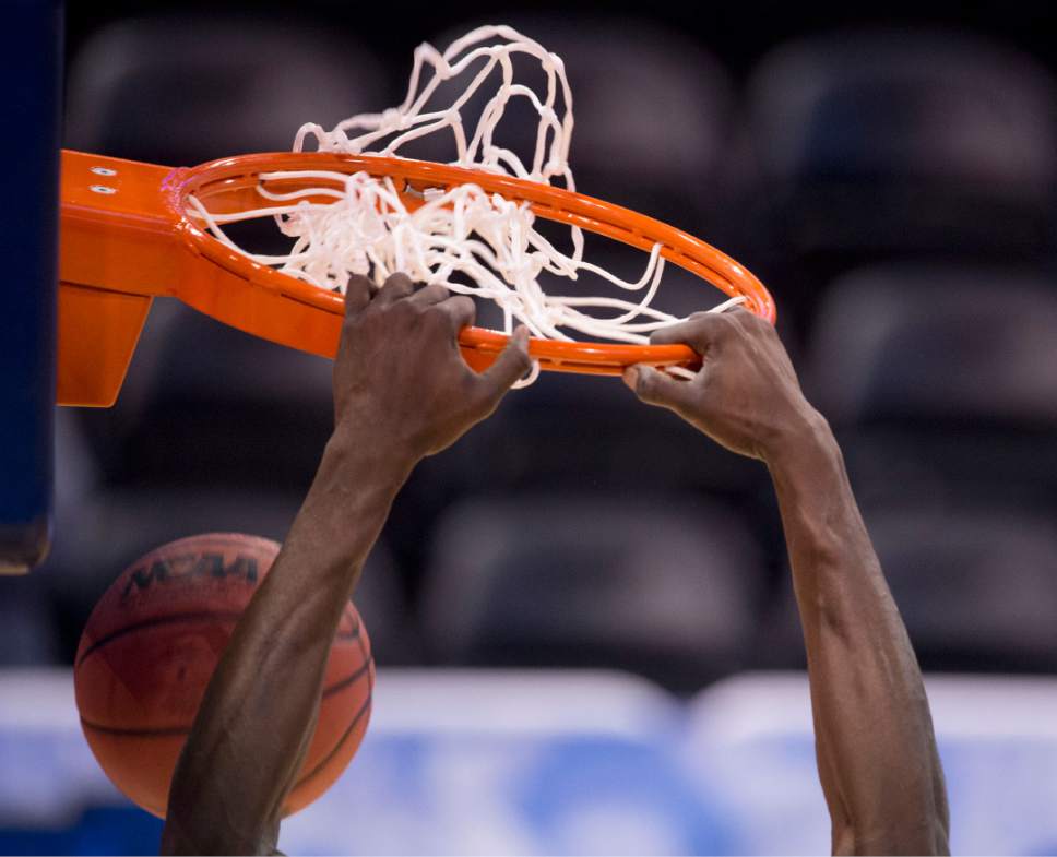 Trent Nelson |  The Salt Lake Tribune

A Vanderbilt player dunks during the team's practice at NCAA Tournament in Salt Lake City on Wednesday, March 15, 2017.