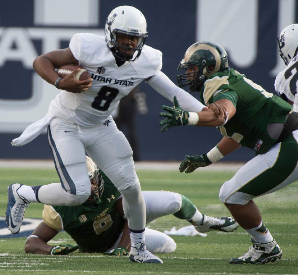 Rick Egan  |  Tribune file photo
Utah State Aggies quarterback Damion Hobbs,  runsagainst Colorado State in 2015, has decided to change positions and practiced with the receivers Tuesday.