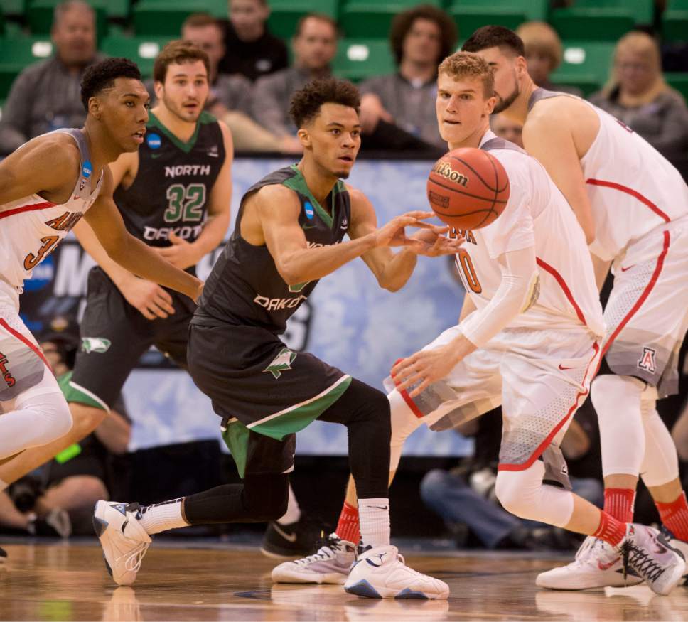Trent Nelson  |  The Salt Lake Tribune

North Dakota Fighting Sioux guard Geno Crandall (0) passes the ball as his team faces Arizona during the first round of the NCAA Tournament in Salt Lake City on Thursday, March 16, 2017.