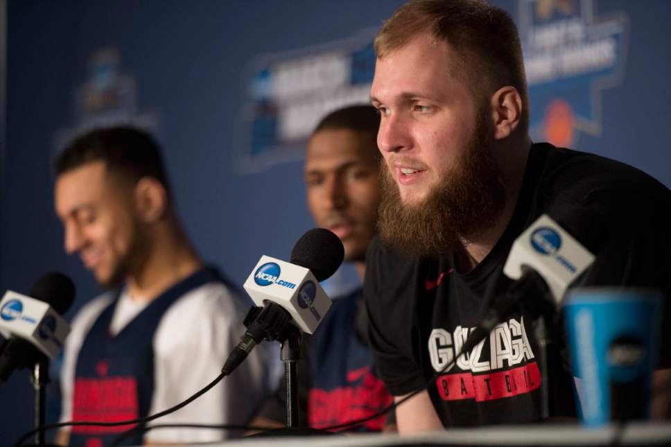 Chris Detrick  |  The Salt Lake Tribune

Gonzaga Bulldogs center Przemek Karnowski (24) takes questions during the team's press conference along with teammates Gonzaga Bulldogs guard Nigel Williams-Goss (5) and Gonzaga Bulldogs guard Jordan Mathews (4) at the NCAA Tournament in Salt Lake City on Wednesday, March 15, 2017.