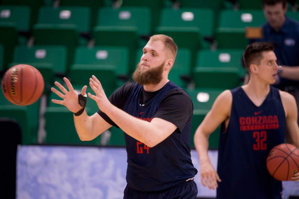 Trent Nelson |  The Salt Lake Tribune

Gonzaga Bulldogs center Przemek Karnowski (24) and Gonzaga Bulldogs forward Zach Collins (32) run drills as the team practices during NCAA Tournament in Salt Lake City on Wednesday, March 15, 2017.