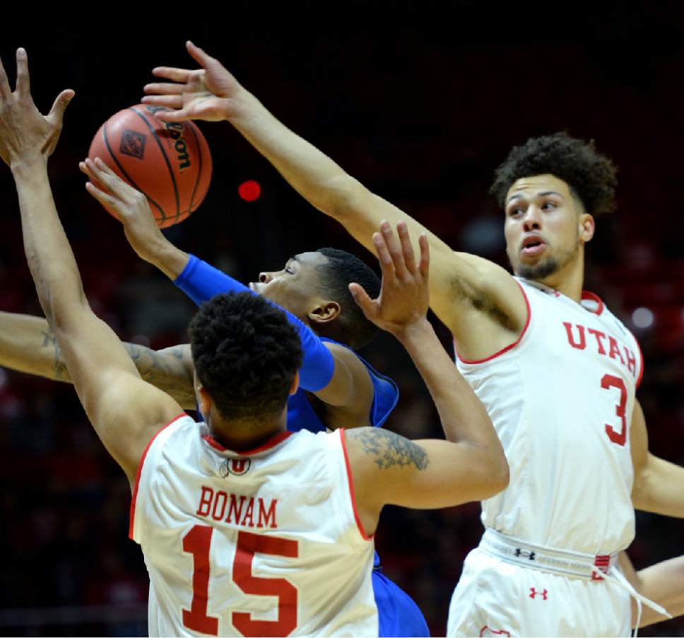 Steve Griffin  |  The Salt Lake Tribune


Utah Utes guard Lorenzo Bonam (15) and Utah Utes guard Devon Daniels (3) team up to block the shot of Boise State Broncos guard Paris Austin (30) during the first round of the NIT at the Huntsman Center on the University of Utah campus in Salt Lake City Tuesday March 14, 2017.