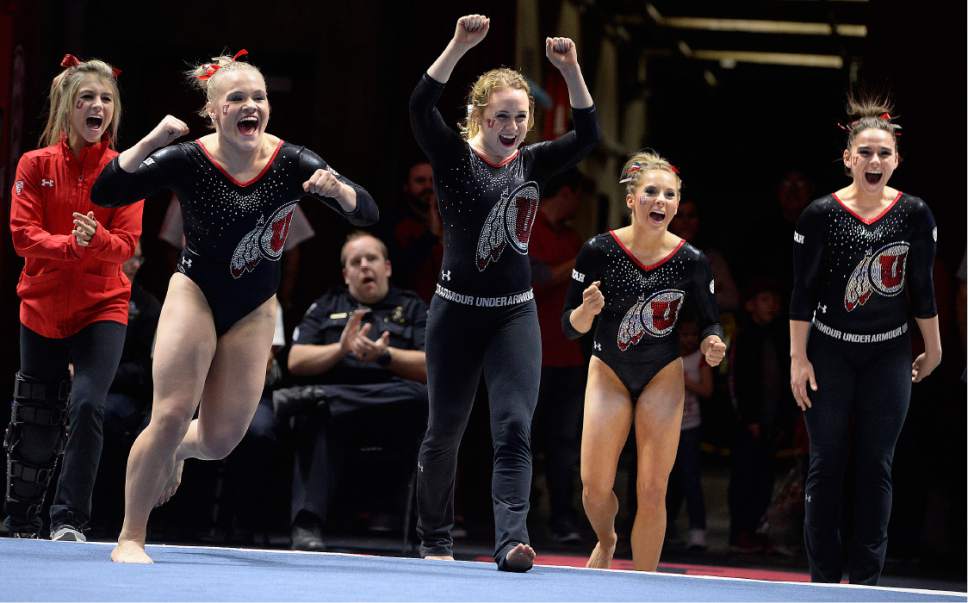 Scott Sommerdorf | The Salt Lake Tribune
Utah team mates rush the floor to congratulate Utah's Baely Rowe after he floor routine. Utah outscored Stanford 197.500 to 196.275, Friday, March 3, 2017.