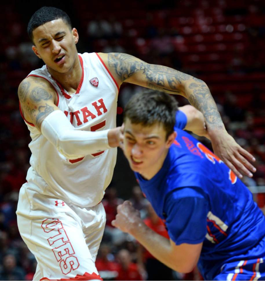 Steve Griffin  |  The Salt Lake Tribune


Utah Utes forward Kyle Kuzma (35) and Boise State Broncos guard Justinian Jessup (3) react after bumping heads during the Utah versus Boise State basketball game in the first round of the NIT at the Huntsman Center on the University of Utah campus in Salt Lake City Tuesday March 14, 2017.