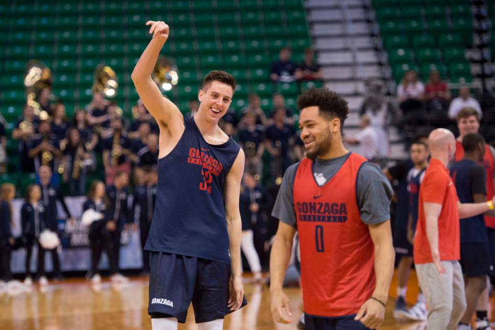 Trent Nelson |  The Salt Lake Tribune

Gonzaga Bulldogs forward Zach Collins (32) laughs with Gonzaga Bulldogs guard Silas Melson (0) as the team practices during NCAA Tournament in Salt Lake City on Wednesday, March 15, 2017.