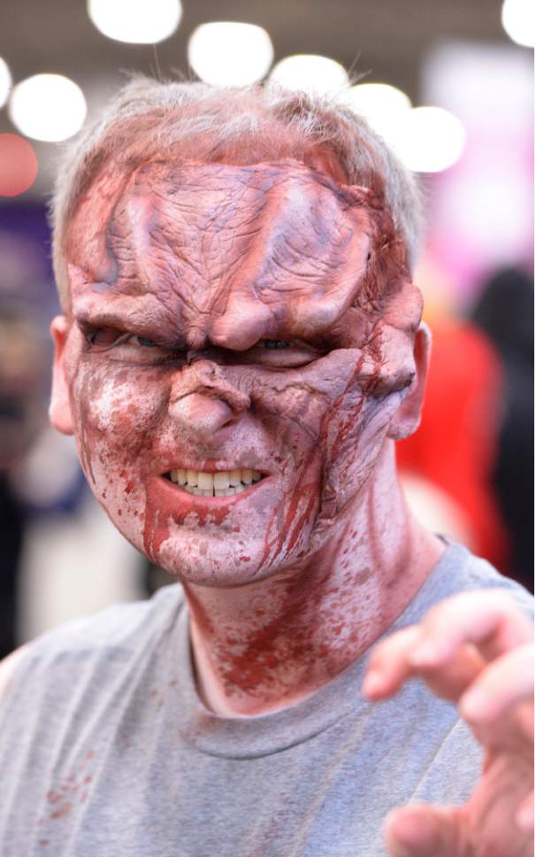 Leah Hogsten  |  The Salt Lake Tribune
John Carlton sports a creepy face. Salt Lake Comic Con's FanX 2016 attendees mingle during the three-day pop-culture convention at the Salt Palace Convention Center, Friday, March 25, 2016.