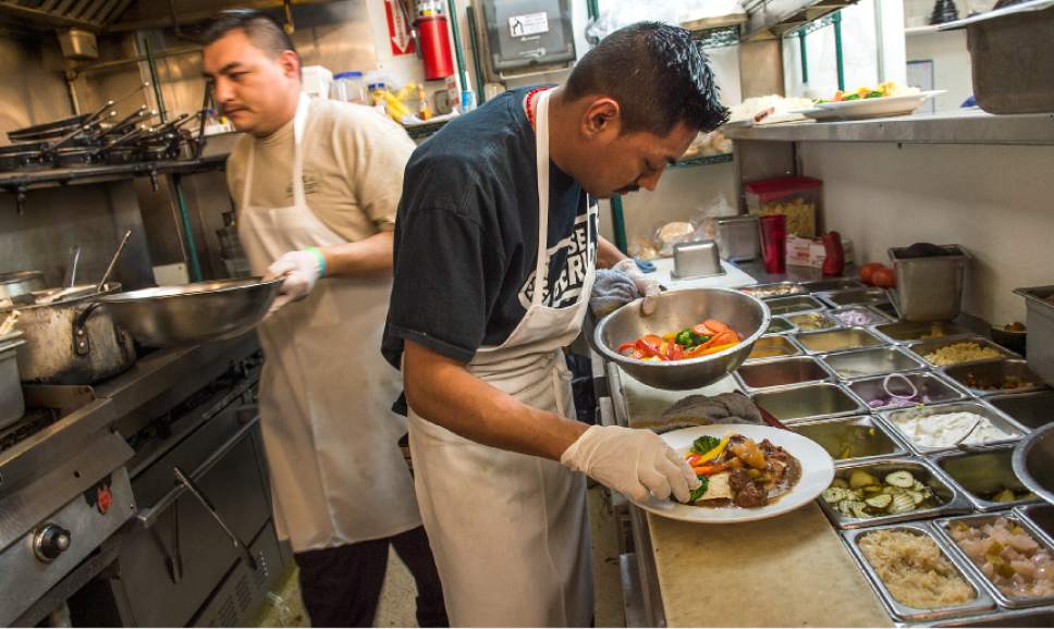 Leah Hogsten  |  The Salt Lake Tribune
Chefs Jose Carreto and Antonio Mendoza at Flanagan's on Main in Park City prepare boxtys, a traditional Irish dish of potato pancakes, stuffed with different meats and stews.