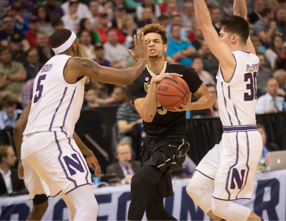 Chris Detrick  |  The Salt Lake Tribune

Vanderbilt Commodores guard Matthew Fisher-Davis (5) comes under pressure from Northwestern Wildcats and Northwestern Wildcats guard Bryant McIntosh (30) during first round of the NCAA Tournament in Salt Lake City on Thursday, March 16, 2017.