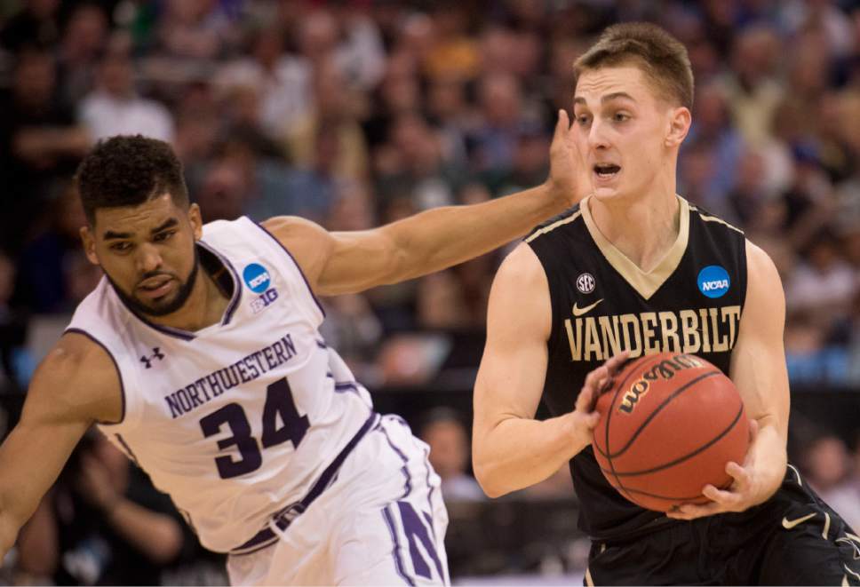 Chris Detrick  |  The Salt Lake Tribune

Vanderbilt Commodores guard Riley LaChance (13) moves past Northwestern Wildcats guard Sanjay Lumpkin (34) during first round of the NCAA Tournament in Salt Lake City on Thursday, March 16, 2017.