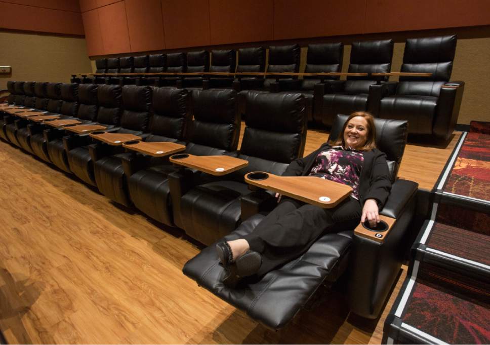 Rick Egan  |  The Salt Lake Tribune

Rachel Lueras, national marketing manager of Regal Entertainment Group, demonstrates the reclining chairs during the grand opening of the Regal Crossroads 14 on Thursday, March 16, 2017.