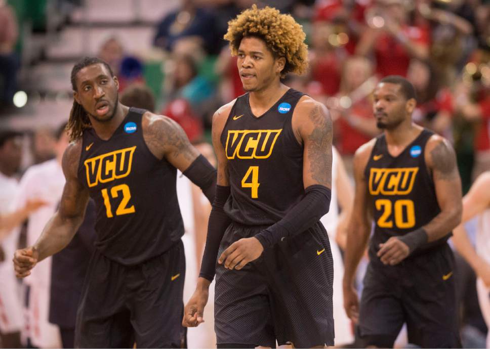 Trent Nelson  |  The Salt Lake Tribune

Virginia Commonwealth players Mo Alie-Cox (12), Justin Tillman (4) and Jordan Burgess (20) head to the locker room at the end of the first half during the first round of the NCAA Tournament in Salt Lake City on Thursday, March 16, 2017.