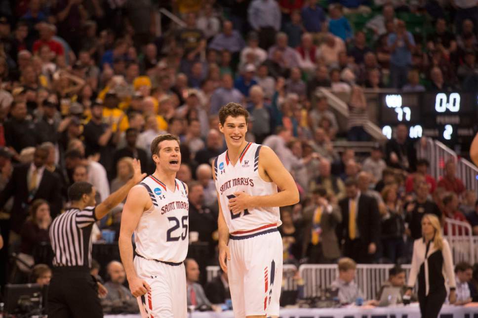 Chris Detrick  |  The Salt Lake Tribune

St. Mary's Gaels guard Joe Rahon (25) and St. Mary's Gaels center Evan Fitzner (21) celebrate their victory over the Virginia Commonwealth Rams during the first round of the NCAA Tournament in Salt Lake City on Thursday, March 16, 2017.