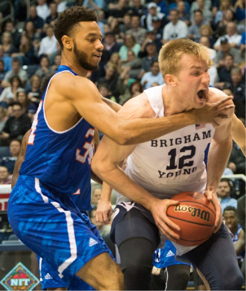 Rick Egan  |  The Salt Lake Tribune

Texas-Arlington Mavericks forward Faith Pope (34) stops Brigham Young Cougars forward Eric Mika (12) from taking a shot, in NIT basketball action Brigham Young Cougars vs. Texas-Arlington Mavericks, at the Marriott Center, Wednesday, March 15, 2017.