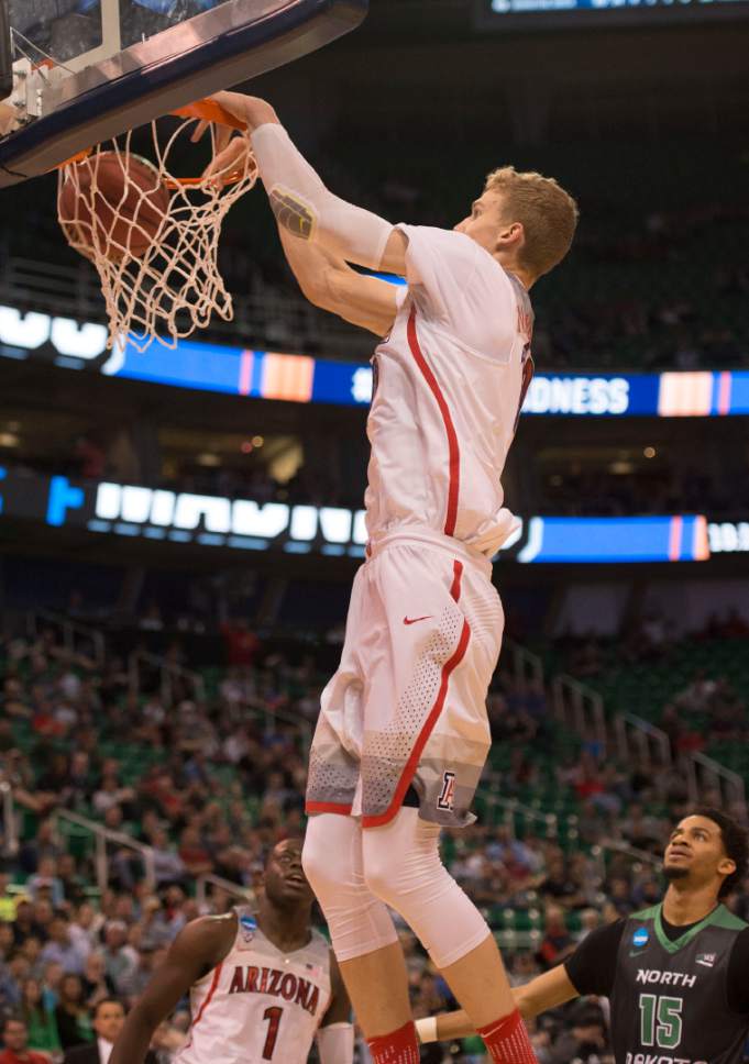Trent Nelson  |  The Salt Lake Tribune

Arizona Wildcats forward Lauri Markkanen (10) dunks during the first round of the NCAA Tournament in Salt Lake City on Thursday, March 16, 2017.