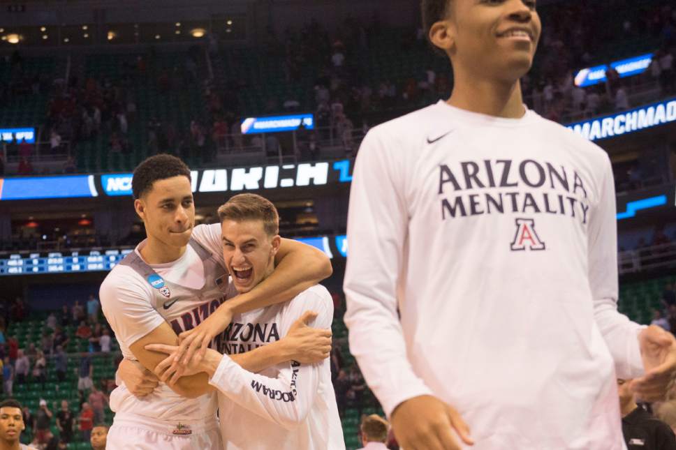 Chris Detrick  |  The Salt Lake Tribune

Arizona Wildcats center Chance Comanche (21) hugs teammate Arizona Wildcats forward Jake DesJardins (55) after they beat St. Mary's in the NCAA tournament in Salt Lake City on Saturday, March 18, 2017.