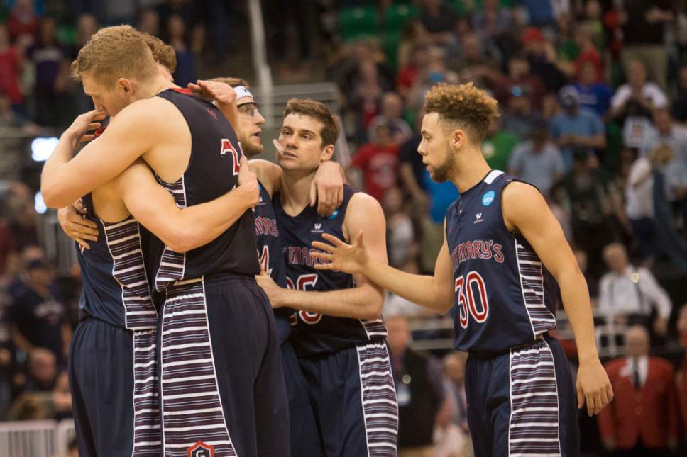 Chris Detrick  |  The Salt Lake Tribune

St. Mary's players embrace after losing to Arizona in the NCAA tournament in Salt Lake City on Saturday, March 18, 2017.