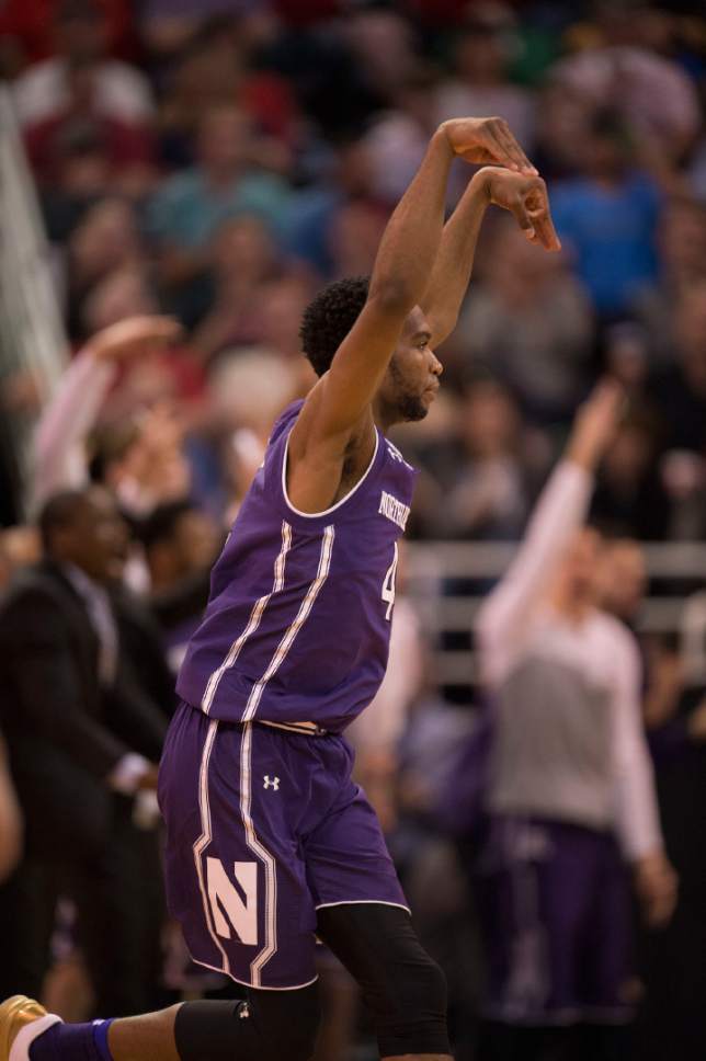 Trent Nelson  |  The Salt Lake Tribune

Northwestern Wildcats forward Vic Law (4) celebrates a three pointer against Gonzaga as the teams face off in the NCAA tournament in Salt Lake City on Saturday, March 18, 2017.