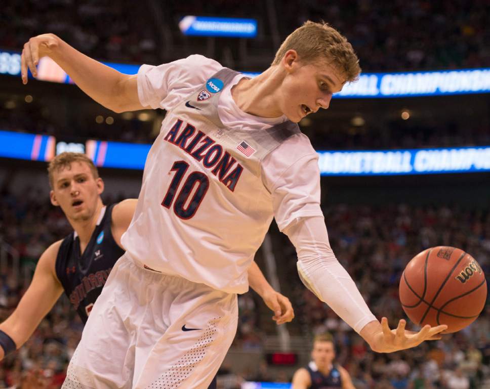 Trent Nelson  |  The Salt Lake Tribune

Arizona Wildcats forward Lauri Markkanen (10) tries to get control of a rebound while facing St. Mary's in the NCAA tournament in Salt Lake City on Saturday, March 18, 2017.