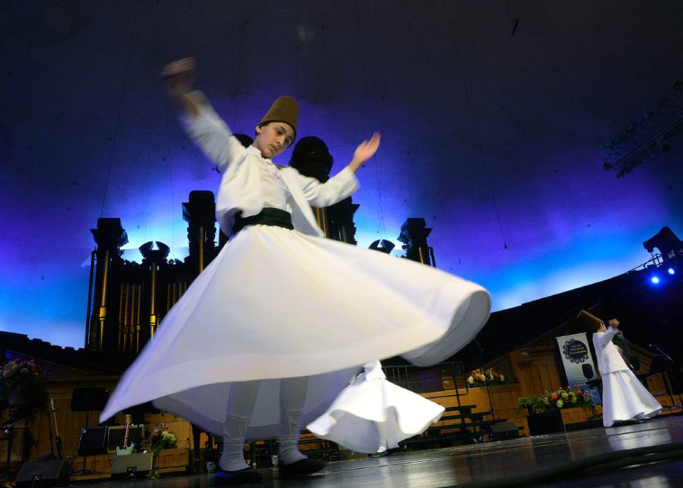 Al Hartmann  |  The Salt Lake Tribune
Members of  Pacifica Institure Youth Dervishes perform a dervish at  Sacred Music Evening in the Tabernacle Sunday March 19.  In most Sufi orders a dervish is known to pracitce "dhikr "through physical exertions to attain an ecstatic trance to reach God. The evening included musical performances, dances, scripture readings, and prayers from many Utah faith traditions.
Its part of the annual Interfaith Month that's been going on every year since the 2002 Olympic Winter Games in Salt Lake City.