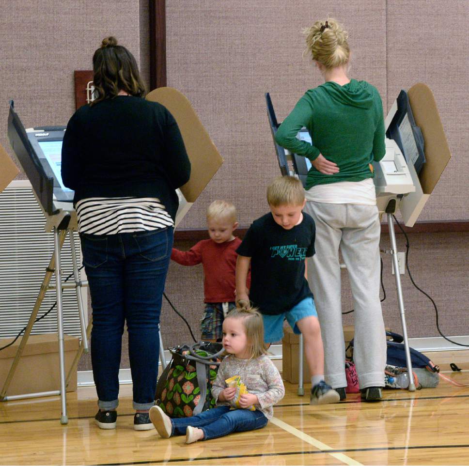 Al Hartmann  |  The Salt Lake Tribune
People vote at the polling station at South Jordan Founders Park LDS Church in Daybreak-South Jordan on election day Tuesday Nov. 8. Voting was a breeze.  No waiting in lines and children friendy too.