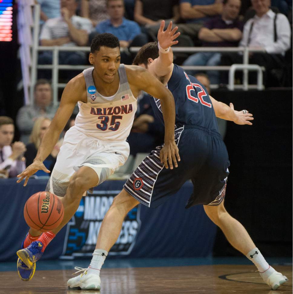 Chris Detrick  |  The Salt Lake Tribune

Arizona Wildcats guard Allonzo Trier (35) goes around St. Mary's Gaels forward Dane Pineau (22) as the teams face off in the NCAA tournament in Salt Lake City on Saturday, March 18, 2017.