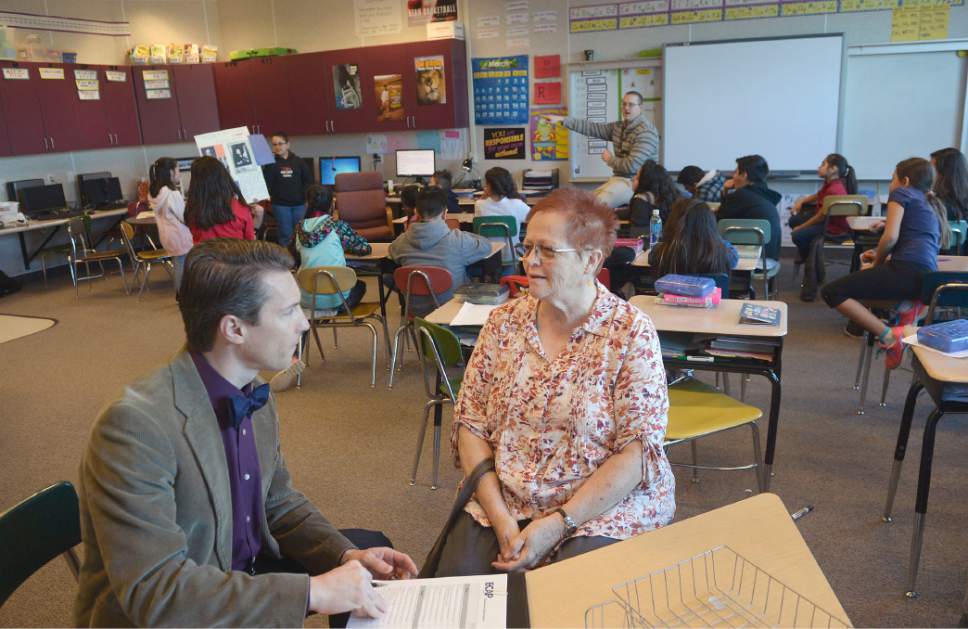 Al Hartmann  |  The Salt Lake Tribune
Logan Hall, left, Salt Lake School Distirct Peer Assistance Review supervisor, meets with one of the program's mentor teachers Pat Draper at Bachman Elementary in Salt Lake City.  The teacher mentoring program has boosted staff retention rates but recently lost its state funding. The district plans to continue the program internally.  Draper, a teacher with 40 years of experience mentors Daniel Mills as he teaches his fourth grade class.