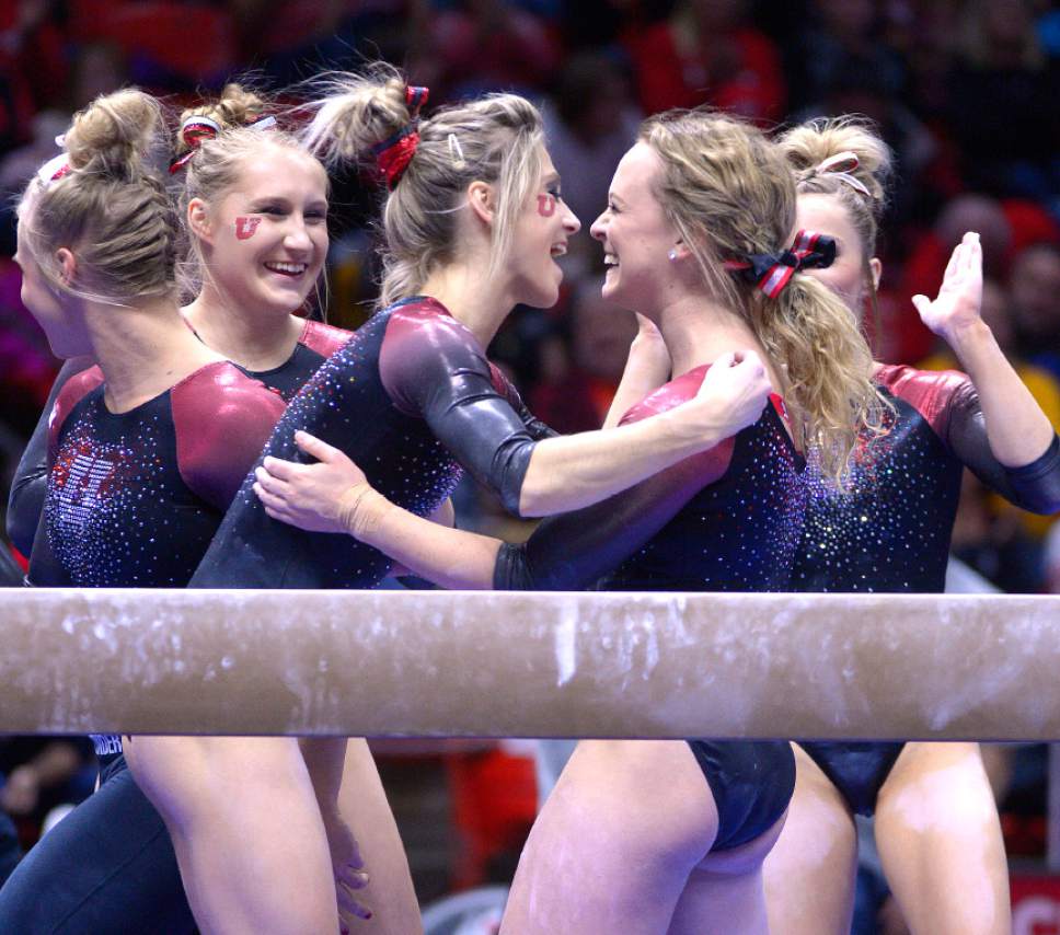 Leah Hogsten  |  The Salt Lake Tribune
The team celebrates with Maddy Stover after her routine on the beam. University of Utah gymnastics fans got their first glimpse of this yearís team at the Red Rocks Preview intrasquad meet at the Huntsman Center, Friday, December 9, 2016.