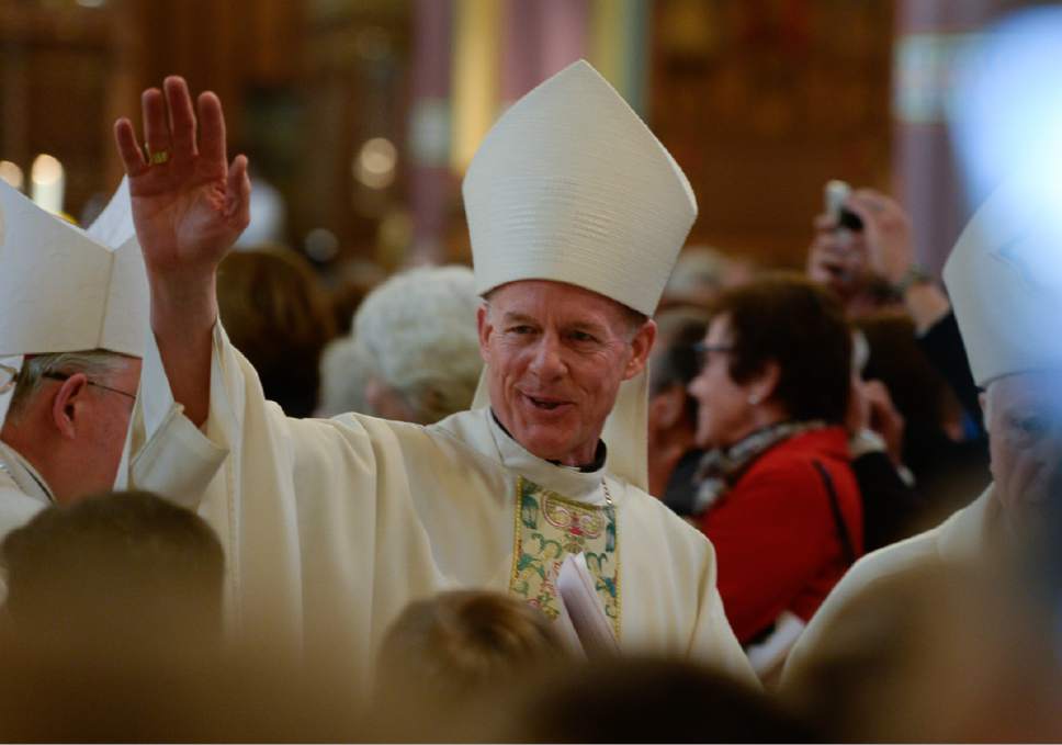 Francisco Kjolseth | The Salt Lake Tribune
Archbishop John C. Wester who departed in spring 2015 to become archbishop of Santa Fe, acknowledges the cheering crowd at the Cathedral of the Madeleine following installation ceremonies for his successor.