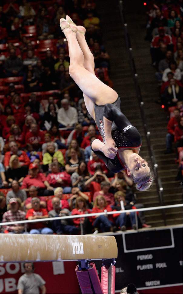 Scott Sommerdorf | The Salt Lake Tribune
Utah's MaKenna Merrell during the dismount of her 9.775 beam routine. Utah outscored Stanford 197.500 to 196.275, Friday, March 3, 2017.