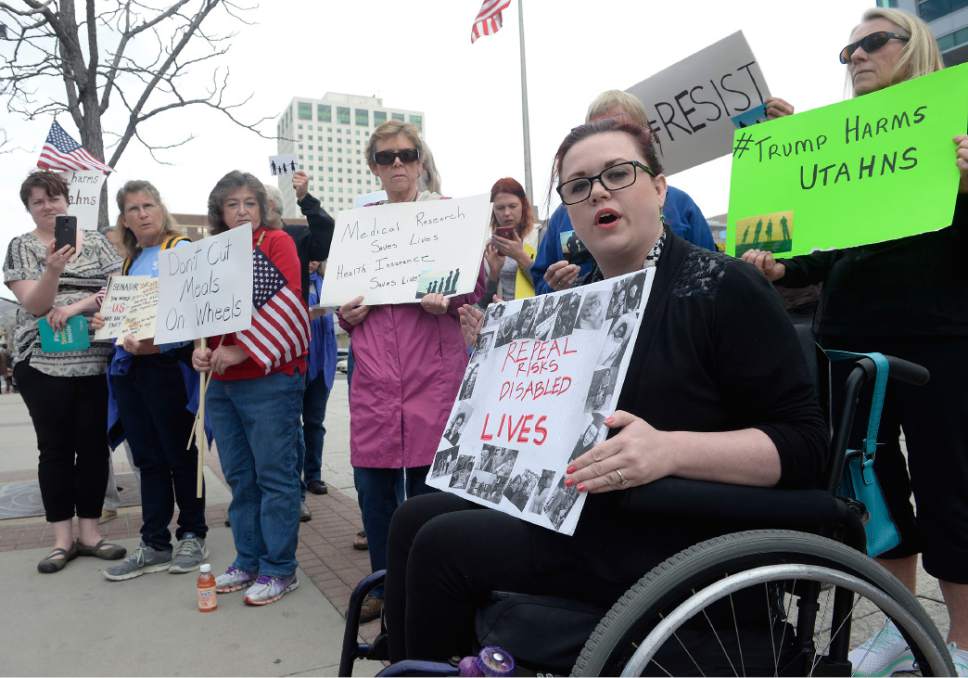 Al Hartmann  |  The Salt Lake Tribune
People gathered in front of the Wallace Bennett Federal Building in Salt Lake City Tuesday March 21  calling on Senators Mike Lee and Orrin Hatch to "stand for Utah values."  Stacy Stanford, with the Healthcare Rights Coalition holds sign of people she knows with disabilities that could be affected by the dismantling of the Affordable Care Act and proposed cuts to social programs under the proposed Trump budget.